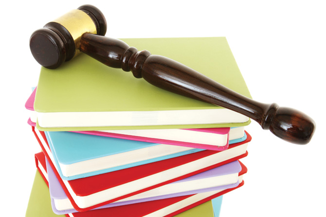 welcome-stack-of-books-with-gavel